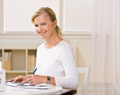 Woman writing checks